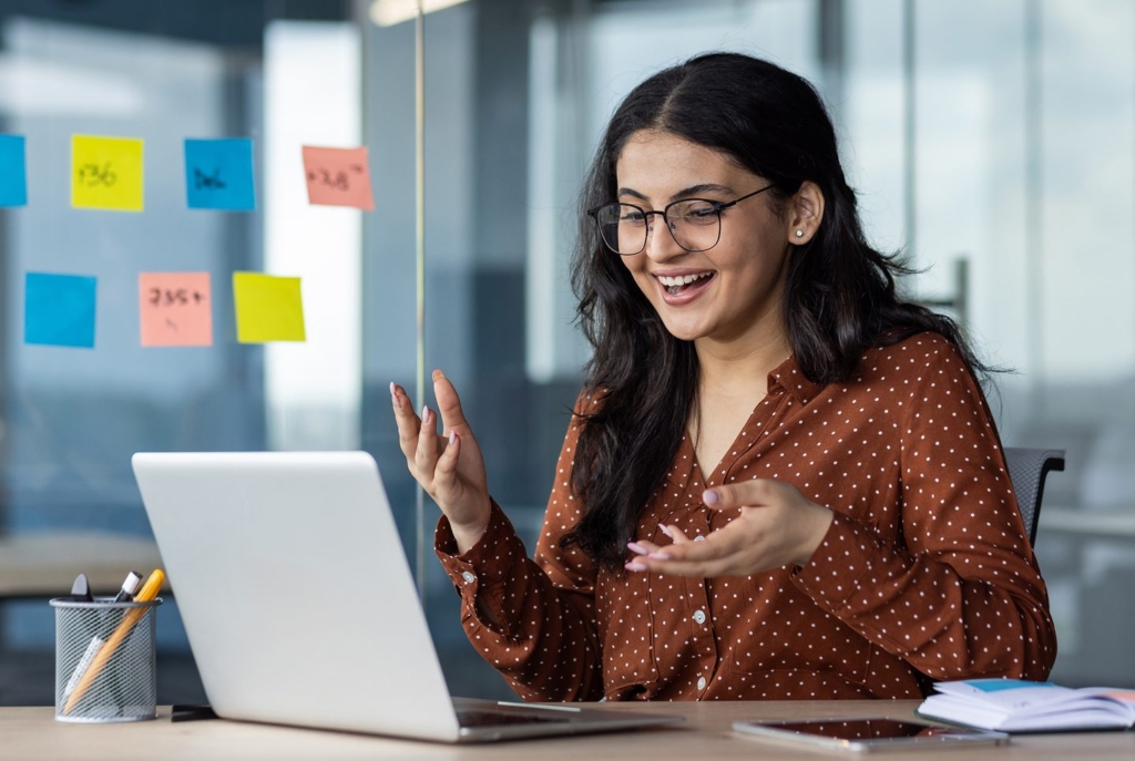 women in front of computer talking