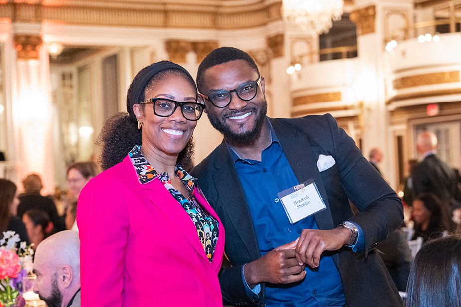 Attendees at evening of hope smiling at camera