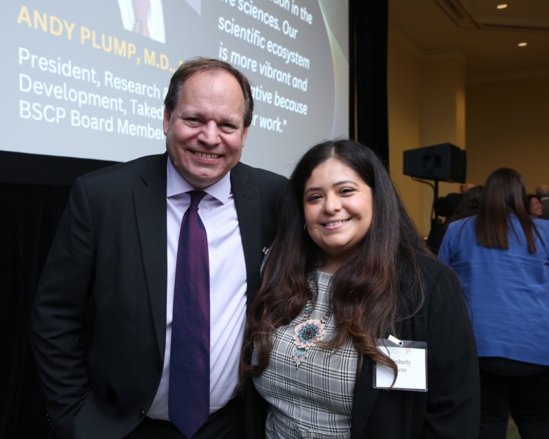 hope scholar with corporate sponsor smiling at camera