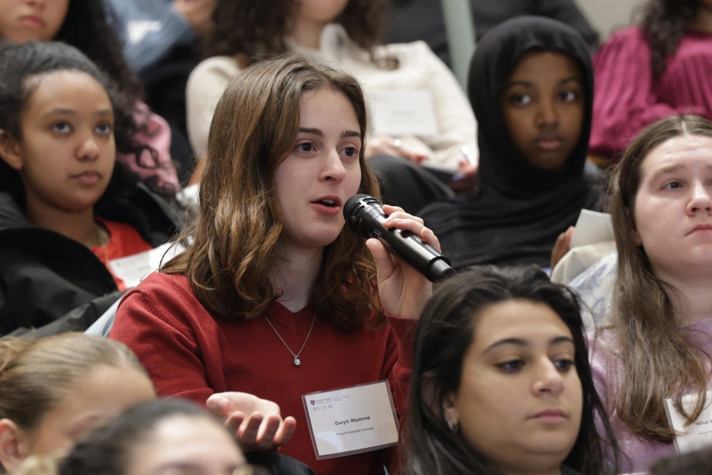 women holding mic asking question