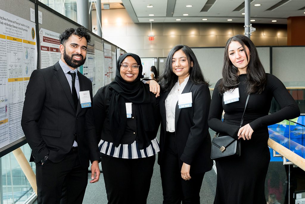 BSCP students standing in a row and smiling at camera